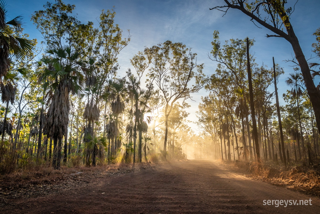 The road is corrugated and dusty.