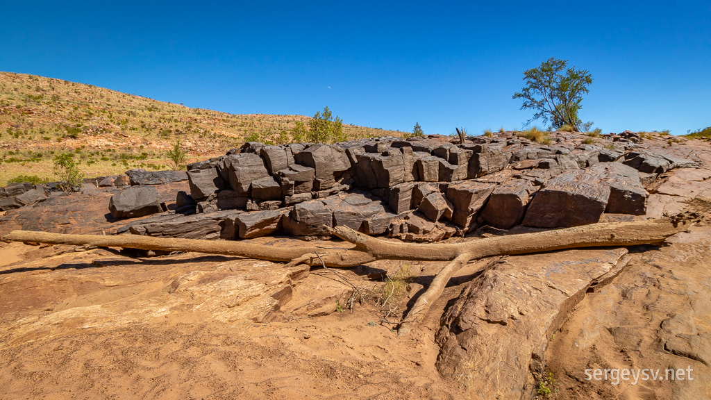 The nearby rocks.