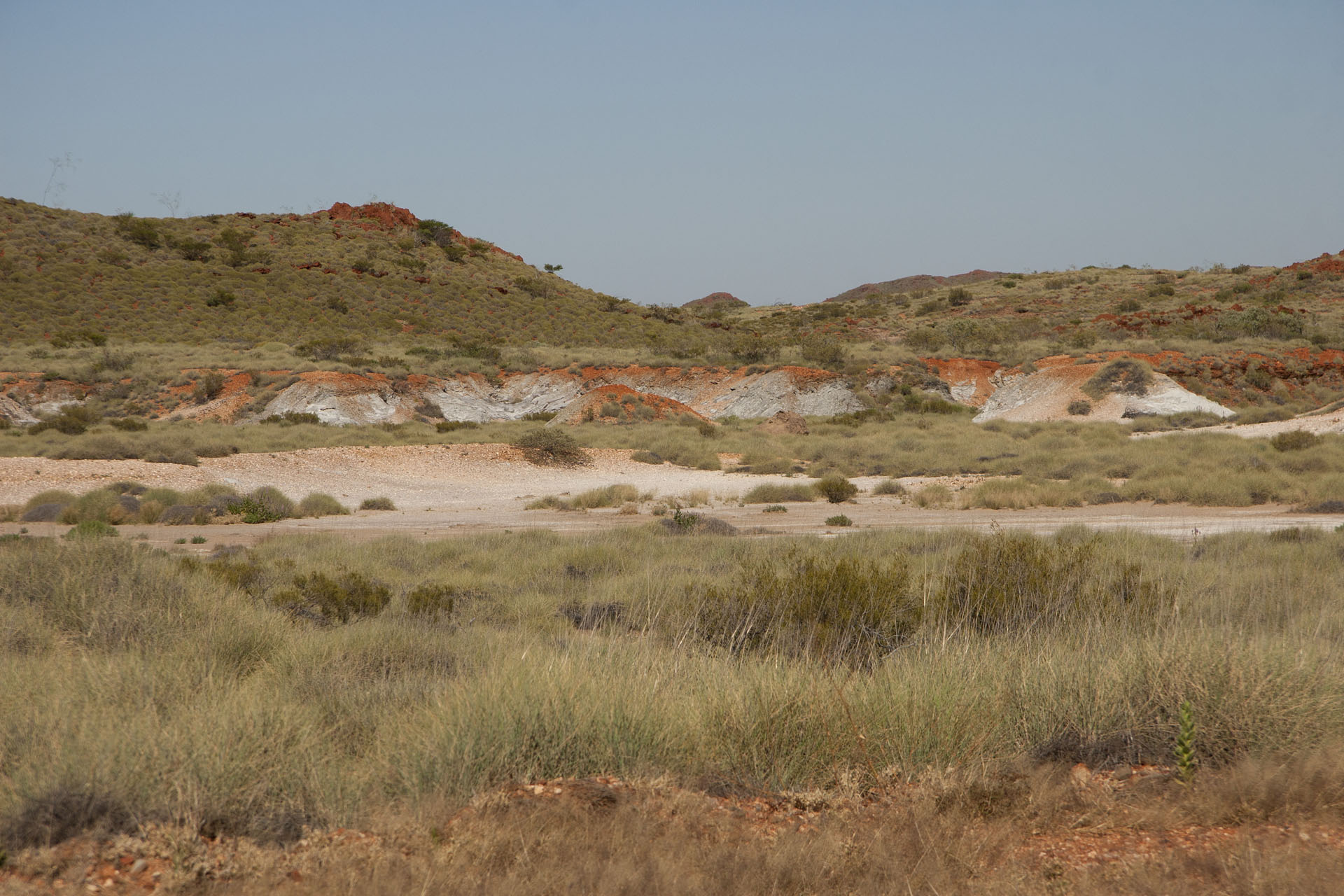 Abandoned mines, with white patches of asbestos.