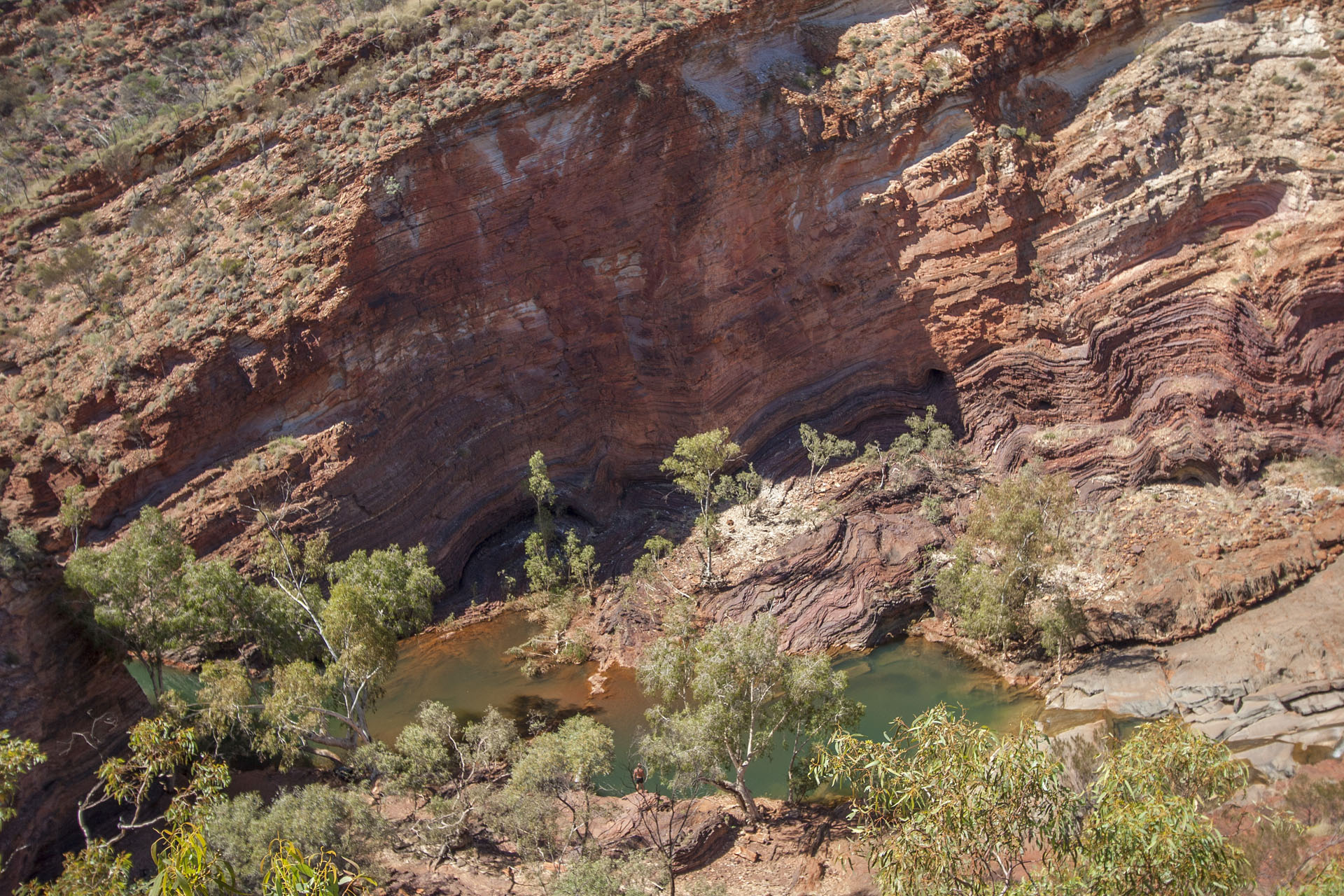 A pool down below with a guy who wants to take a plunge.